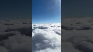 About to descend through the pillow top clouds on a flight in route to Atlanta, GA