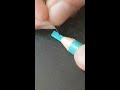 aqua blue pencil carved into the letter i asmr style