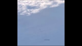 Cylinder Shaped UFO Recorded From Passing Passenger Plane!