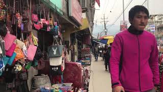 Walking along street of jaigoan Bhutan India boarder