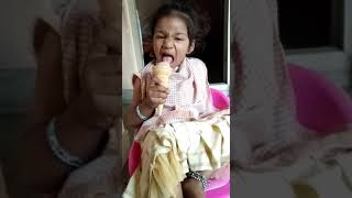 Master yuvin in girl dress eating ice cream