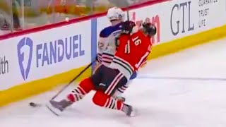 Jason Dickinson Injury helped off ice after tangled up with Vasily Podkolzin | Blackhawks v Oilers