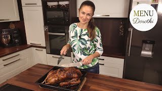 Whole roasted goose in the oven. Recipe for making traditional stuffed goose. MENU by Dorotka.