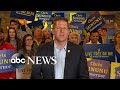 Reelected Gov. Chris Sununu celebrates his victory in New Hampshire