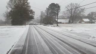 Stopping by the water tower on Lavey Lane in Baker, La., for ghostly view of the road on snow day