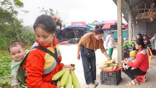 Single mother and her lovely little daughter harvest sweet corn to sell at the country market