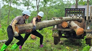 Agricultural vehicle, two sisters transporting large logs in rainy and windy weather.