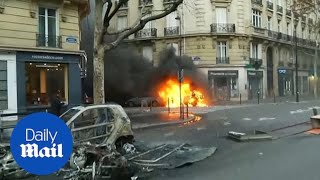 'Yellow vest' protesters burn cars in central Paris