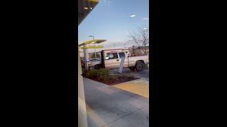 Aggressive driver caught damaging McDonald's drive-thru menu in Madera, CA