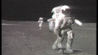 Astronaut Grabs A Big Moon Rock, Then Runs Off With It.