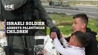 Israeli soldier arrests Palestinian children