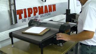 Tippmann roller die cutting press cutting paper using a steel rule cutting die