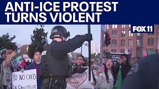 Cop yanks Mexican flag out of protester's hand