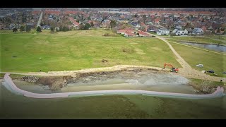 How to Expand a Beach and Recreational Area? Use flood Barriers as a Cofferdam!