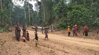 Aka Pygmies in Congolese rainforest try to trade fish for cigarettes.