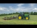 cumbrian silage 2024. rowing ahead of the forager with a john deere 6195r u0026 claas liner rake.