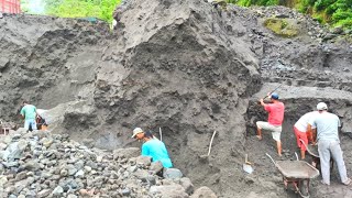 There are miners whose job is to dig up black sand.