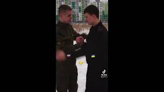 Russian and Ukrainian soldiers hug