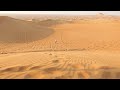 stephen sandboarding in the dubai desert