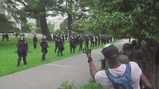 Protesters gather at state Capitol in Sacramento as police stand ready in riot gear