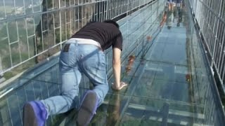 Raw: Tourists Brave Glass-Bottom Bridge