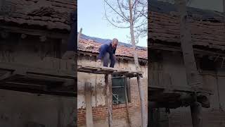 The process of throwing red brick onto the roof