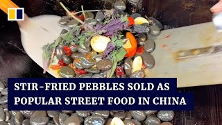 Stir-fried pebbles sold as popular street food in China