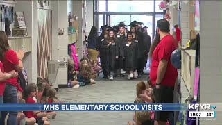 Mandan High School seniors visit their elementary schools