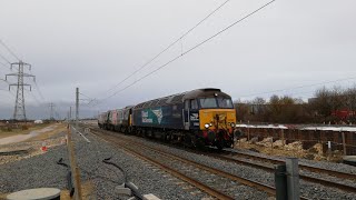 DRS 57303 dragging Europhoenix 91117 and 91120 passing Werrington Junction