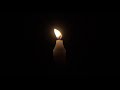 4K Candle Burning Against Black Background