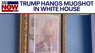 Trump hangs mugshot cover photo in White House