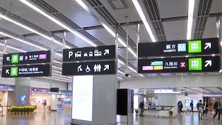 Passengers rush to train station as Hong Kong restricts cross border travel