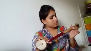 Amrit kamboz playing TUMBI one string instrument