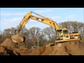 cat 320bl excavator hogging sand