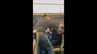 Video shows passengers on Frontier flight detain man who punched window and broke plexiglass