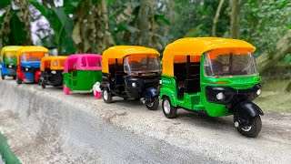 Satisfying Toy Colorfull CNG Auto Rickshaws Hand Driving On Boundary Wall