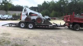 Loading and Unloading Bobcat Skid Steer on Trailer