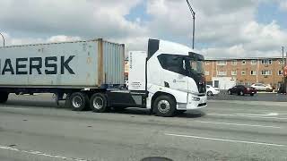 Two BYD Einride Electric Semi trucks honking their horns as they're passing by me in Chicago Ridge.