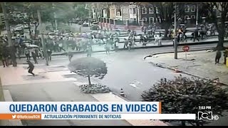 Autoridades buscan a vándalos que atacaron con fuego a policías en Bogotá