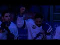 Lightning forward Brown raises fist in air during national anthem