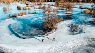 Kicksledding on a giant natural ice rink - Soomaa National Park, Estonia