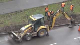 Skill of the operator of the Cat 422E excavator on opening of a roadbed