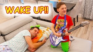 Children try to Wake Sleeping Father with Pretend Play Music Toys!