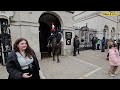 brilliant guard charges his horse when stubborn tourist enters the the white box get away from box