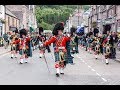 Massed Pipes & Drums parade through Deeside town to start the Ballater Highland Games 2018