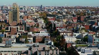 Aerial view of a sunny autumn day in Williamsburg, Brooklyn. Yellow taxi cabs populate the streets