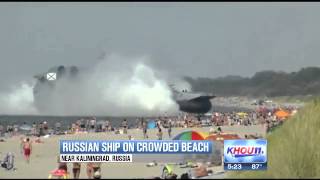 Sunbathers shocked as Russian war ship rolls up on beach