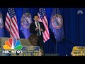 Singing Protesters Interrupt Pete Buttigieg At New Hampshire Town Hall | NBC News