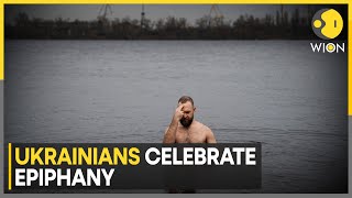 Ukrainians Celebrate Epiphany with Traditional Plunge into the Dnipro River | World News | WION