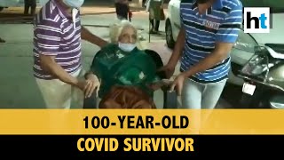 Watch: 100-year-old Covid survivor gets rousing welcome from neighbours